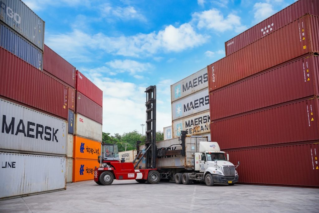forklift-moving-shipping-containers-at-a-port-eos4zfrjcj4